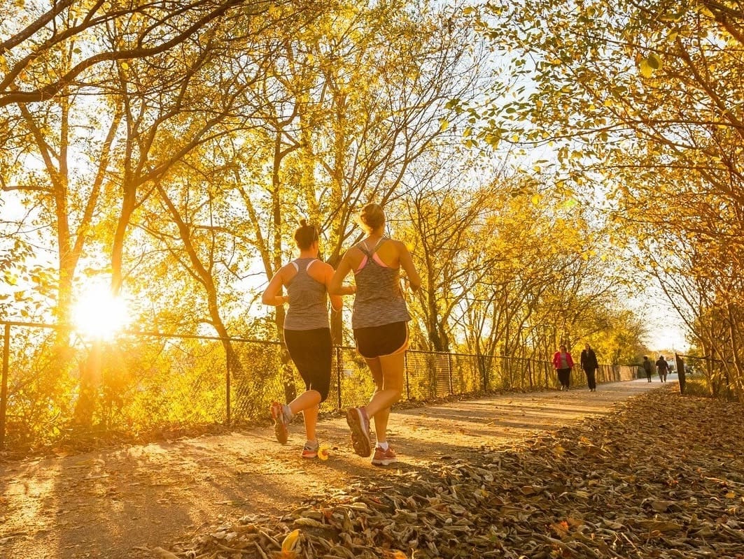 Community members walking and jogging on the rail trail in Spartanburg